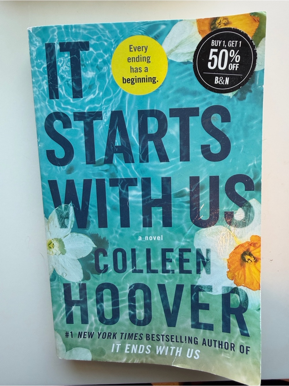 It Starts With Us by — Teal Paperback Novel